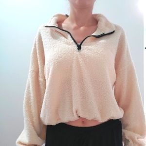 Cropped light sweater